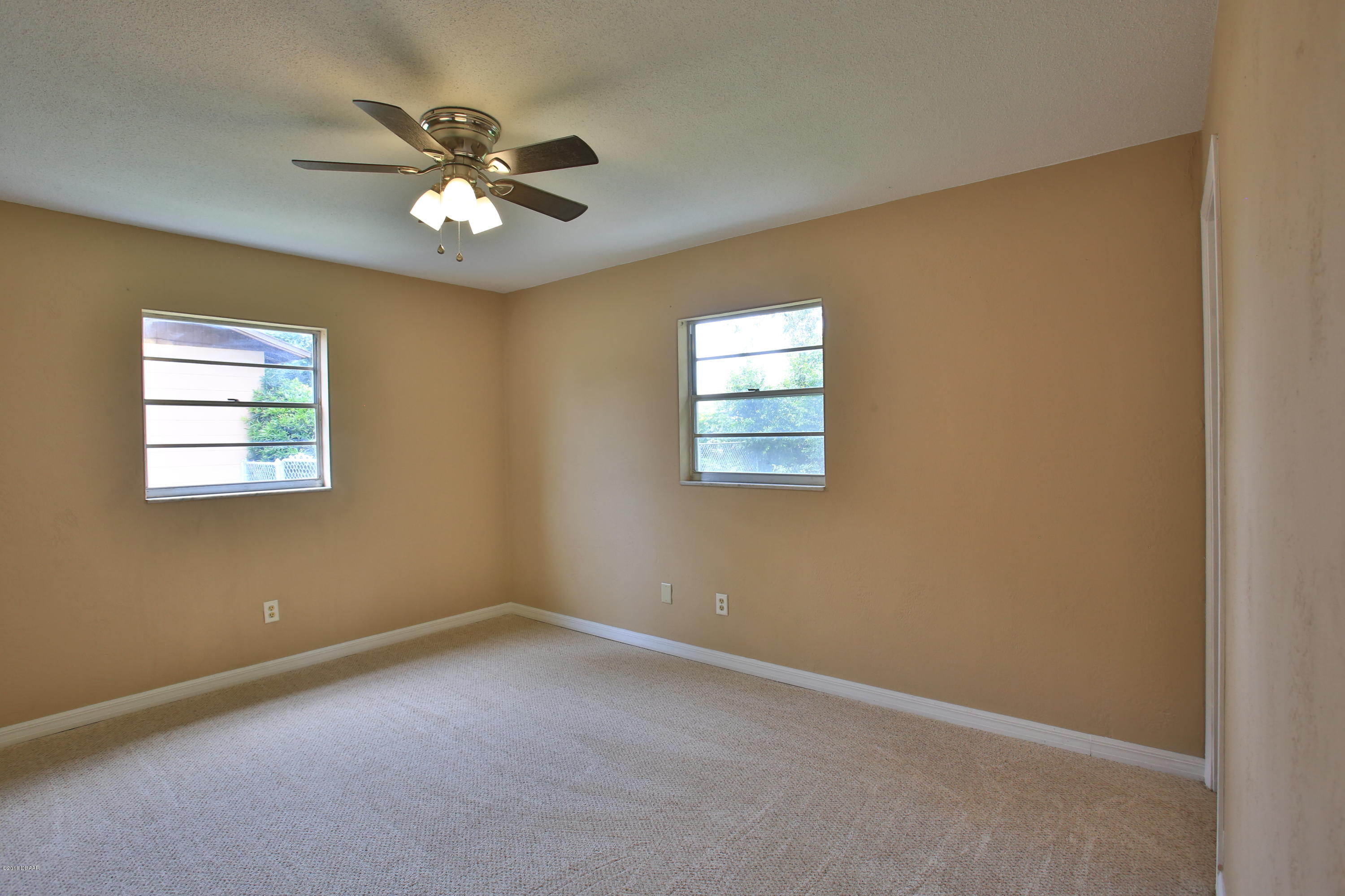22 Raintree Drive Port Orange, FL 32127 - Photo 10 of 17 master bedroom