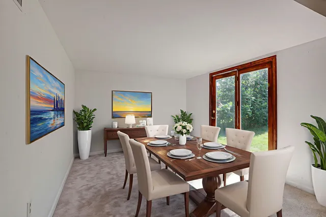 a view of a dining room with furniture window and outside view