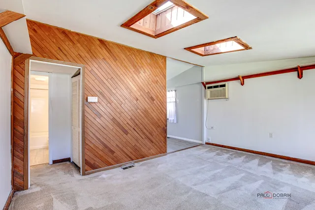 a view of a room with wooden walls