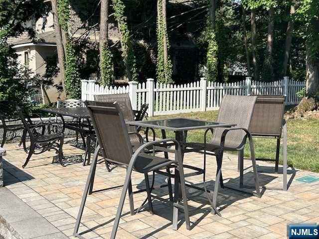 295 Lincoln Avenue Ridgewood, NJ 07450 - Photo 15 of 17 a view of a chairs and tables in the patio