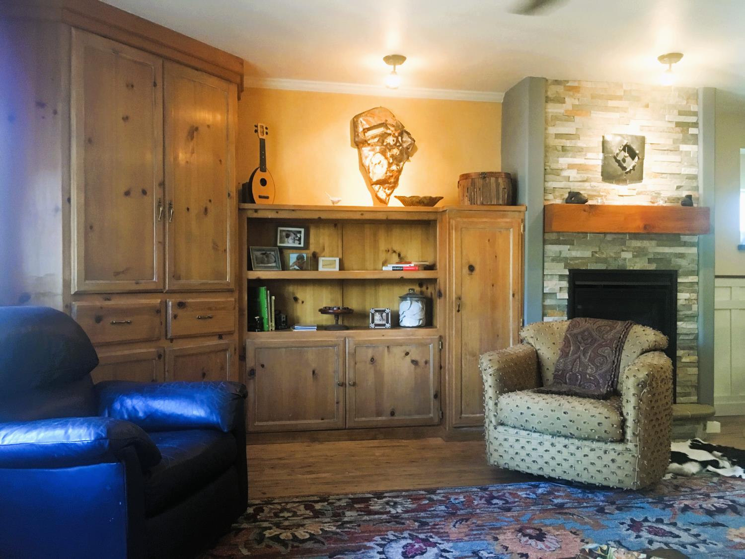 126 Center Street Jackson, CA 95642 - Photo 21 of 82 a living room with furniture and a fireplace