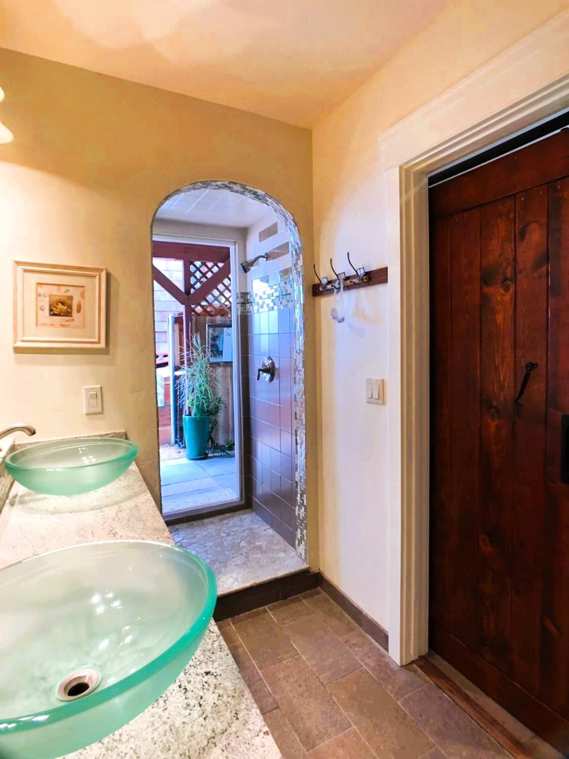 126 Center Street Jackson, CA 95642 - Photo 35 of 79 One of a kind custom shower featuring dual shower heads, tiled surround and sliding patio door to private covered patio