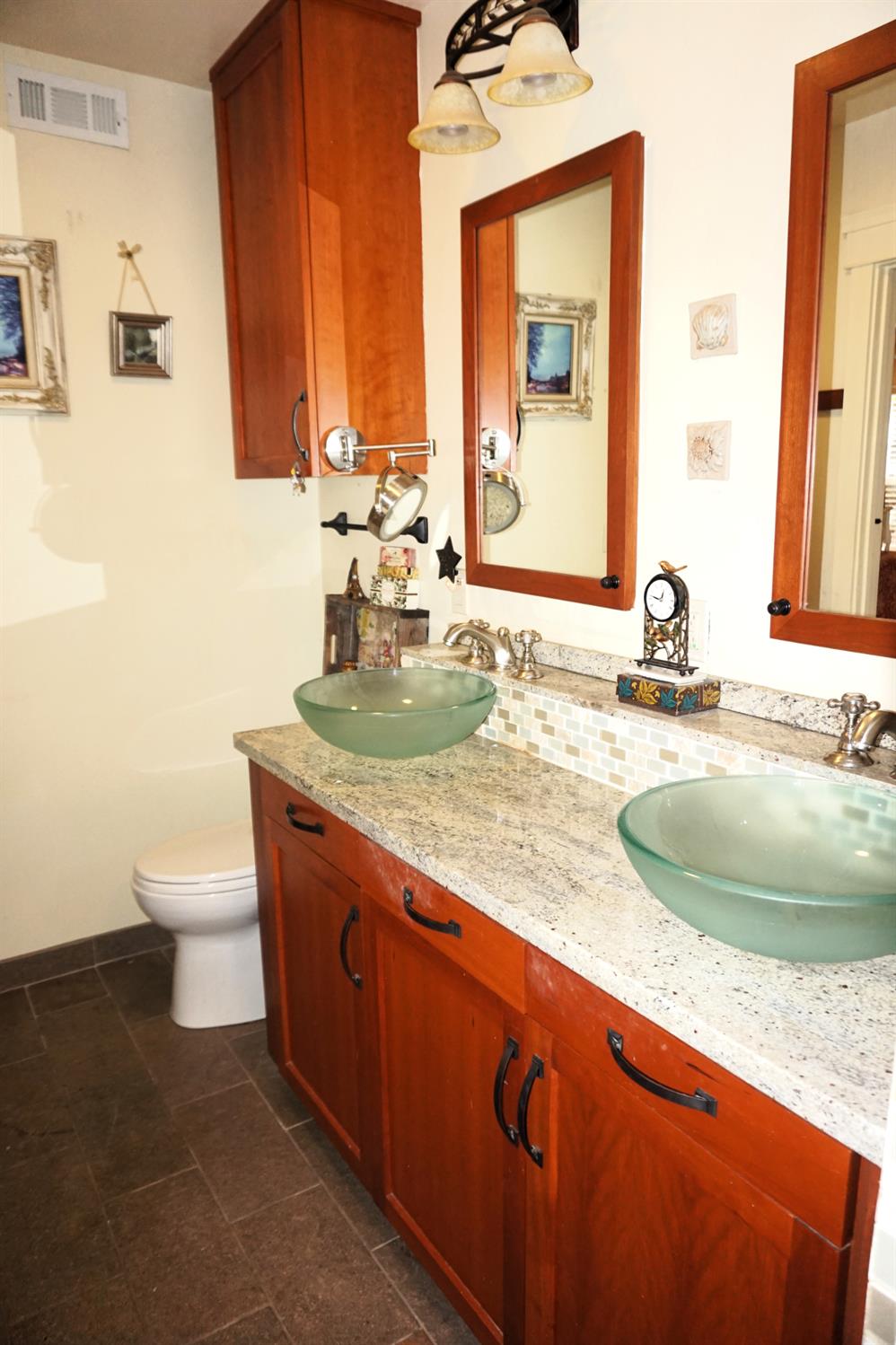 126 Center Street Jackson, CA 95642 - Photo 36 of 79 a bathroom with a granite countertop sink toilet and mirror