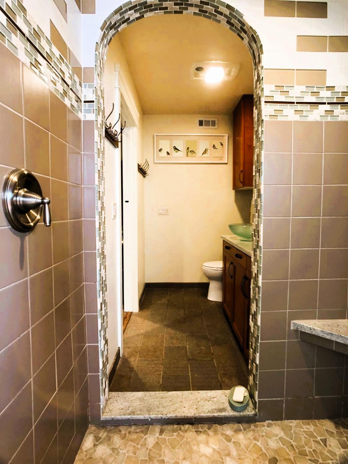 126 Center Street Jackson, CA 95642 - Photo 37 of 79 a bathroom with a granite countertop shower and a mirror