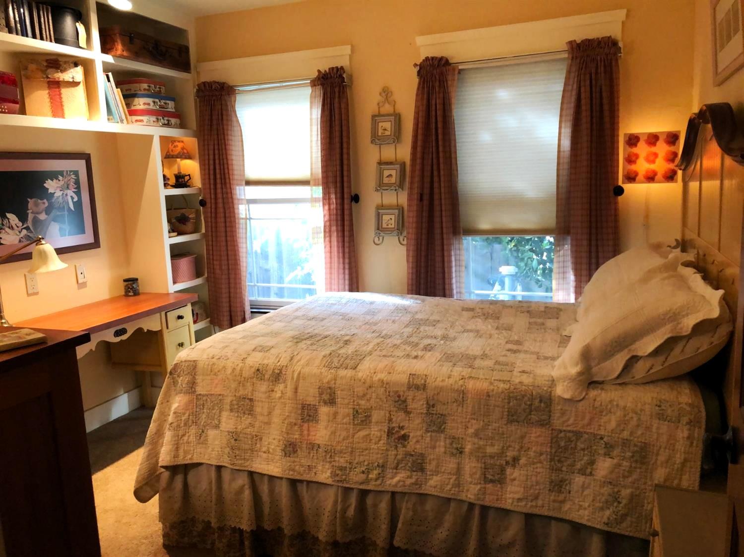 126 Center Street Jackson, CA 95642 - Photo 47 of 79 a bed sitting in a bedroom next to a window