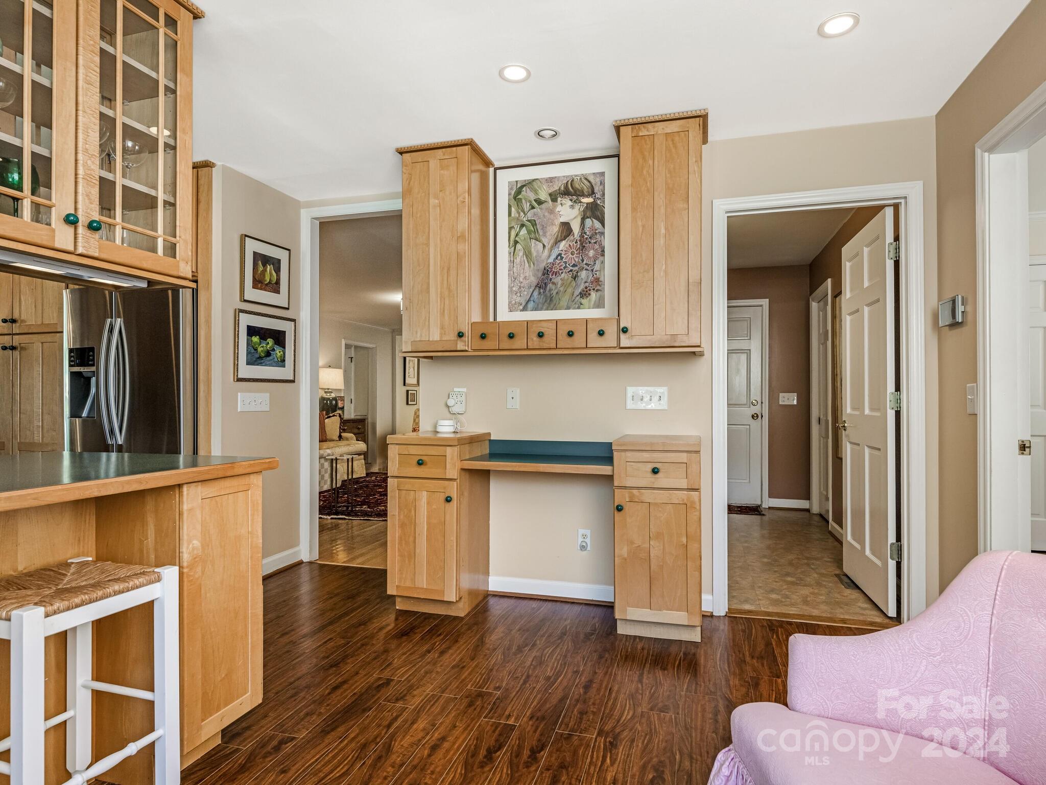 435 Lansdowne Road Charlotte, NC 28270 - Photo 11 of 29 a living room with stainless steel appliances kitchen island granite countertop wooden floors and wide window