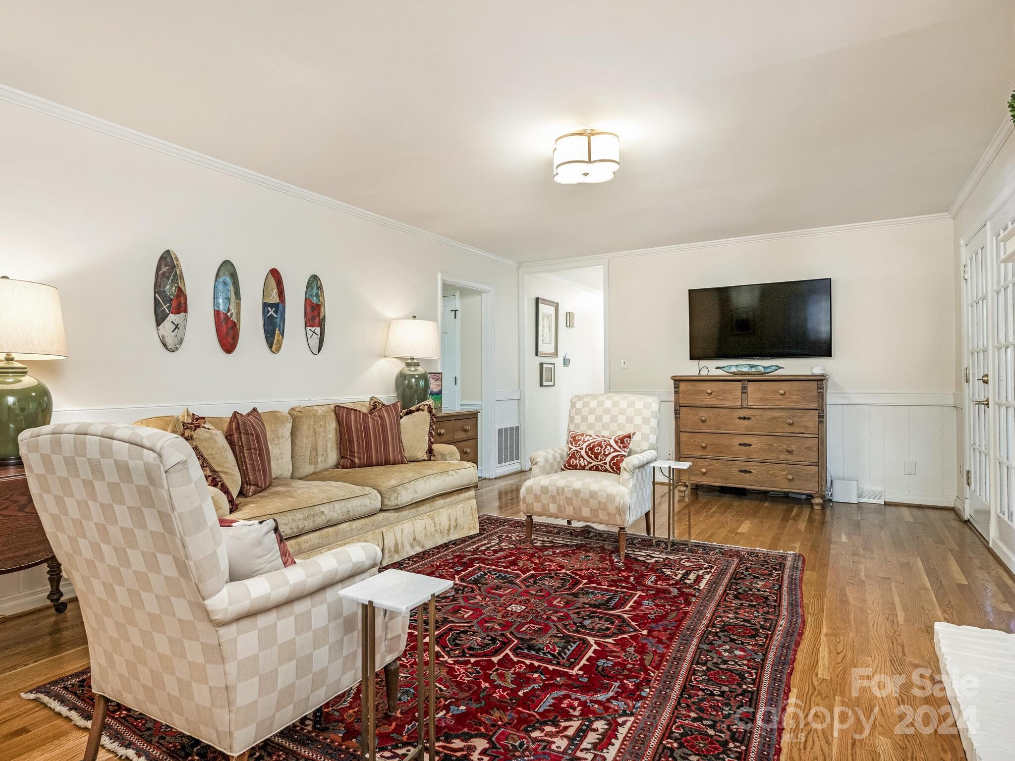 435 Lansdowne Road Charlotte, NC 28270 - Photo 13 of 29 a living room with furniture and a flat screen tv