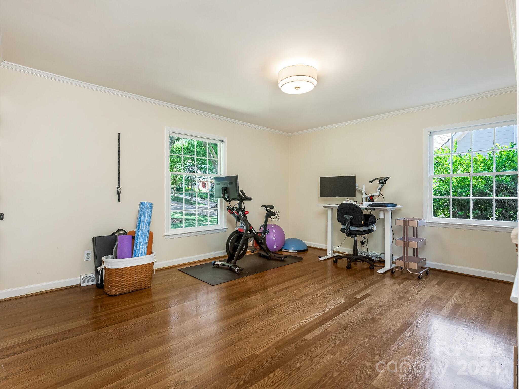 435 Lansdowne Road Charlotte, NC 28270 - Photo 20 of 29 a view of a room with gym equipment and a window