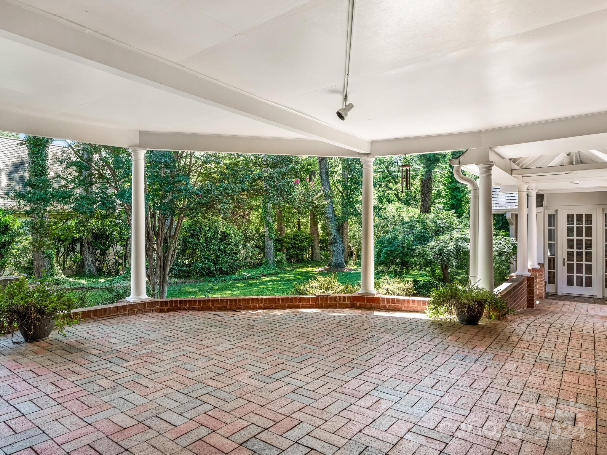 435 Lansdowne Road Charlotte, NC 28270 - Photo 24 of 29 a house with lots of trees in front of it