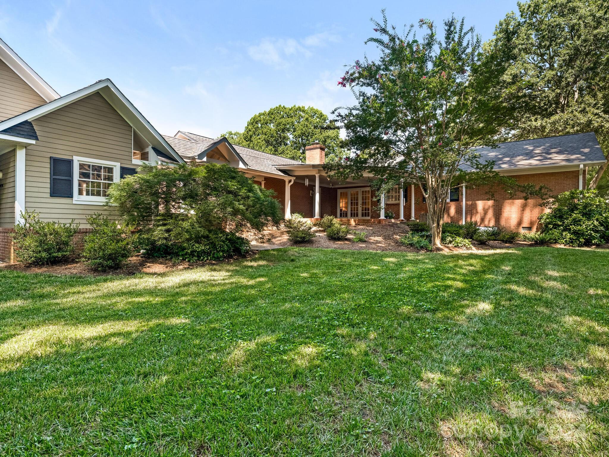 435 Lansdowne Road Charlotte, NC 28270 - Photo 27 of 29 a front view of house with yard and green space