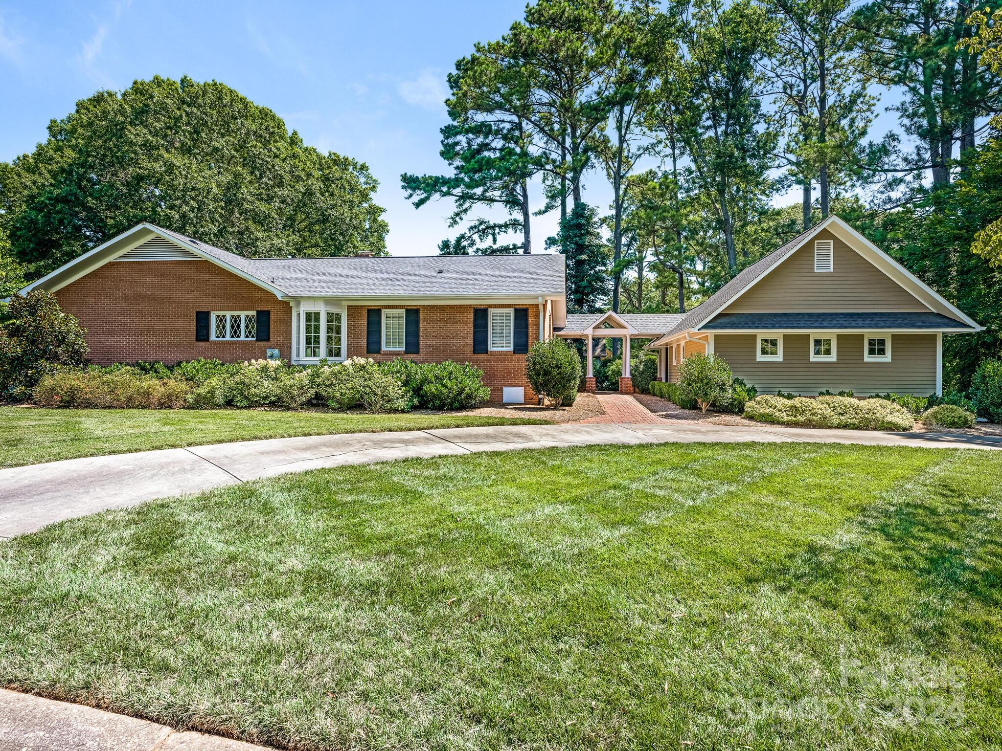 435 Lansdowne Road Charlotte, NC 28270 - Photo 29 of 29 a front view of a house with yard and green space