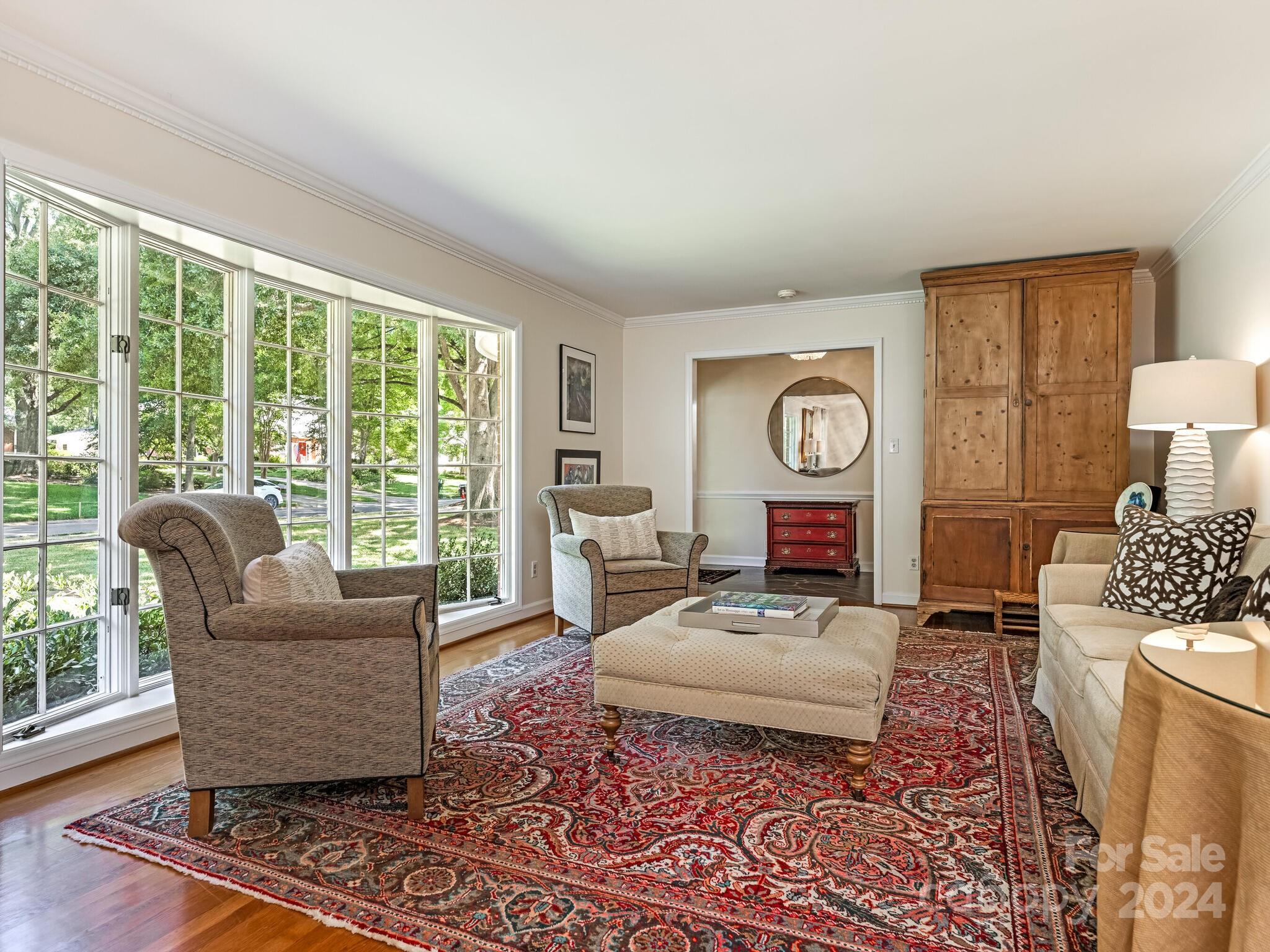 435 Lansdowne Road Charlotte, NC 28270 - Photo 5 of 29 a living room with furniture and a large window