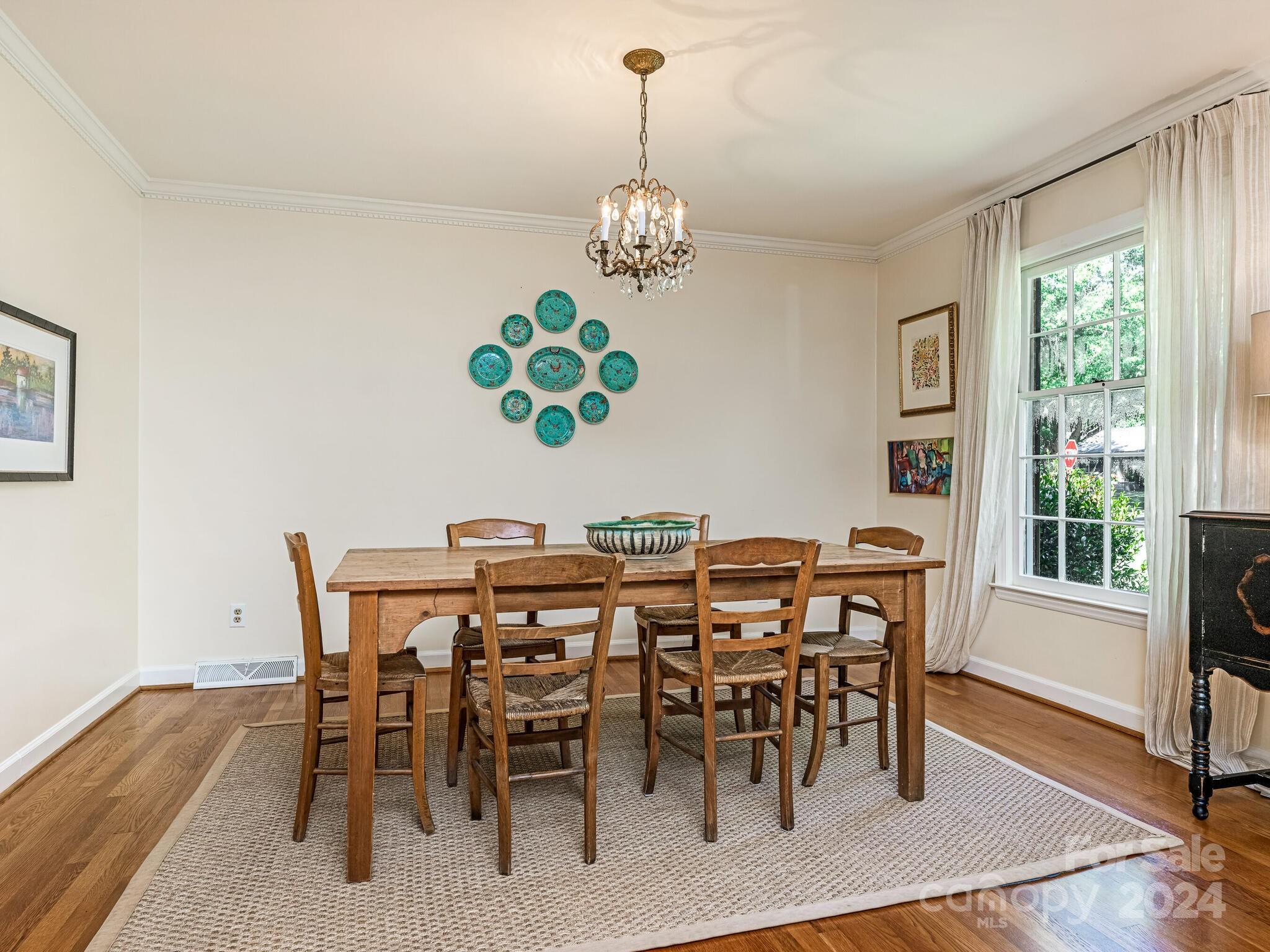 435 Lansdowne Road Charlotte, NC 28270 - Photo 6 of 29 a view of a dining room with furniture window and wooden floor