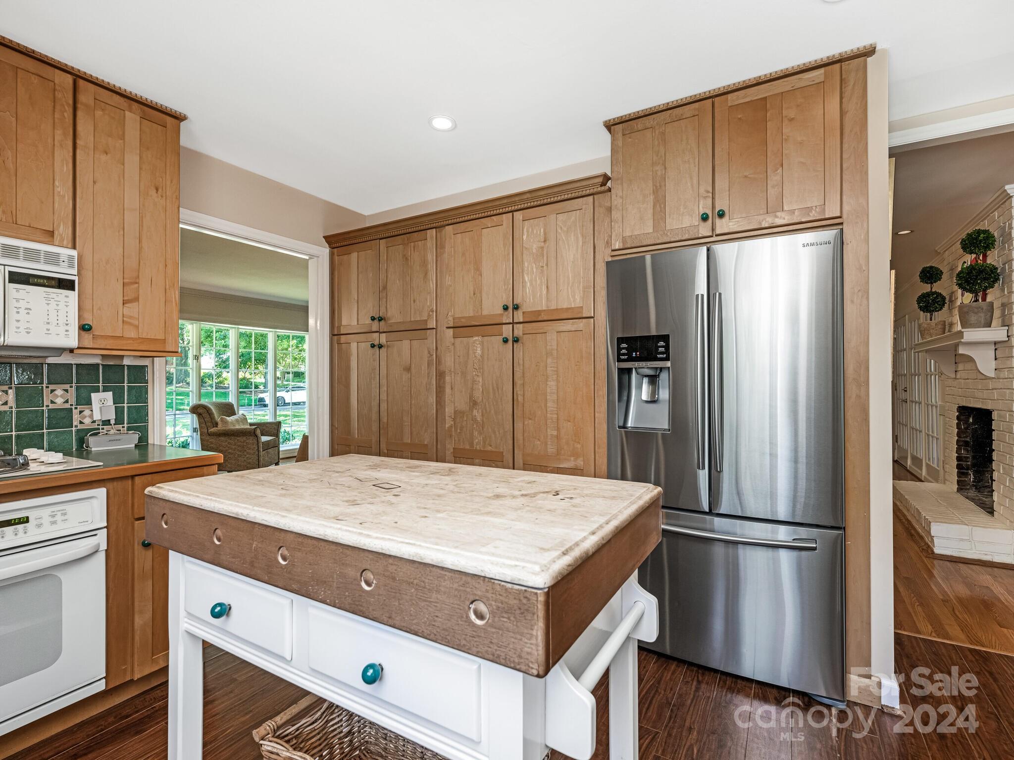 435 Lansdowne Road Charlotte, NC 28270 - Photo 9 of 29 a kitchen with a refrigerator a sink and a refrigerator