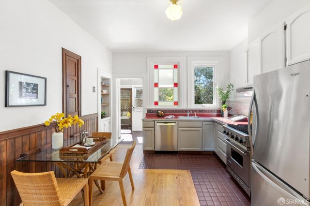 a stove top oven sitting inside of a kitchen