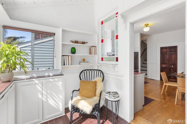 a bathroom with a sink toilet and a mirror