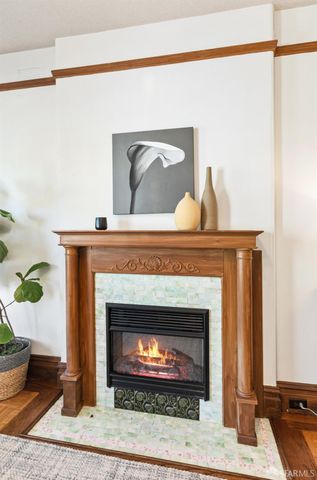a living room with furniture a flat screen tv and a large window