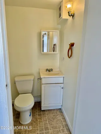 a bathroom with a toilet and a sink