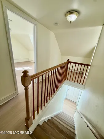 a view of entryway with wooden floor