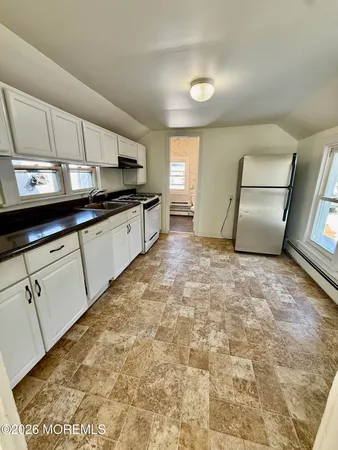 a large kitchen with cabinets