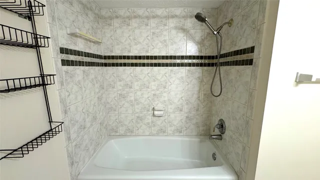 a bathroom with a shower and a shower