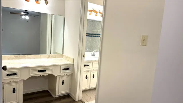a bathroom with a sink a mirror and a shower