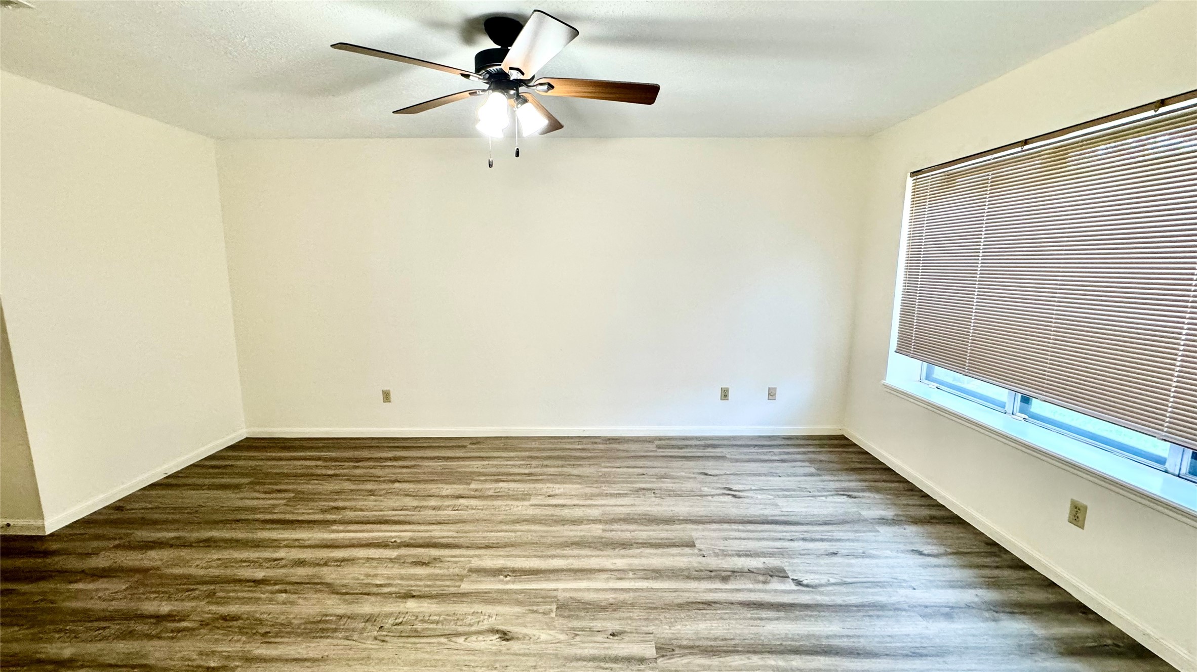 618 Cannon Ball Drive Spring, TX 77380 - Photo 18 of 26 a view of a room with wooden floor and a ceiling fan