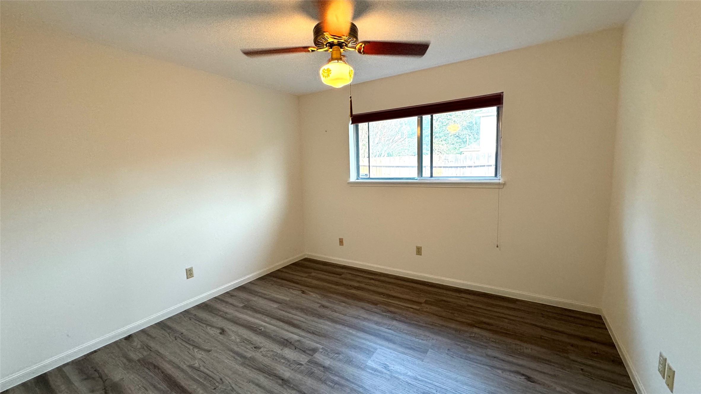 618 Cannon Ball Drive Spring, TX 77380 - Photo 20 of 26 wooden floor in an empty room with a window