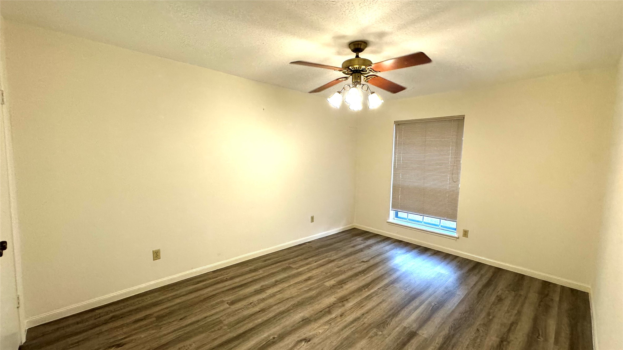 618 Cannon Ball Drive Spring, TX 77380 - Photo 21 of 26 a view of an empty room with wooden floor and a fan