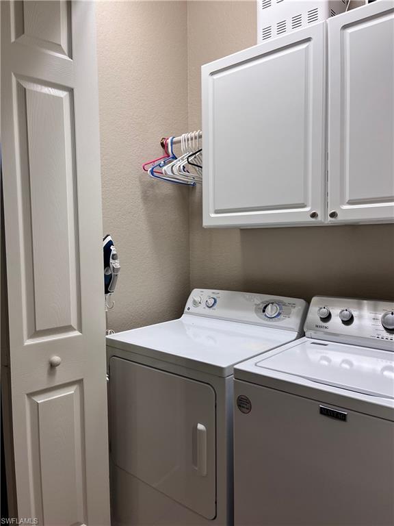 9126 Chula Vista Street, Unit 12301 Naples, FL 34113 - Photo 16 of 36 a utility room with dryer and washer
