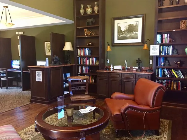 a view of a hallway with wooden doors
