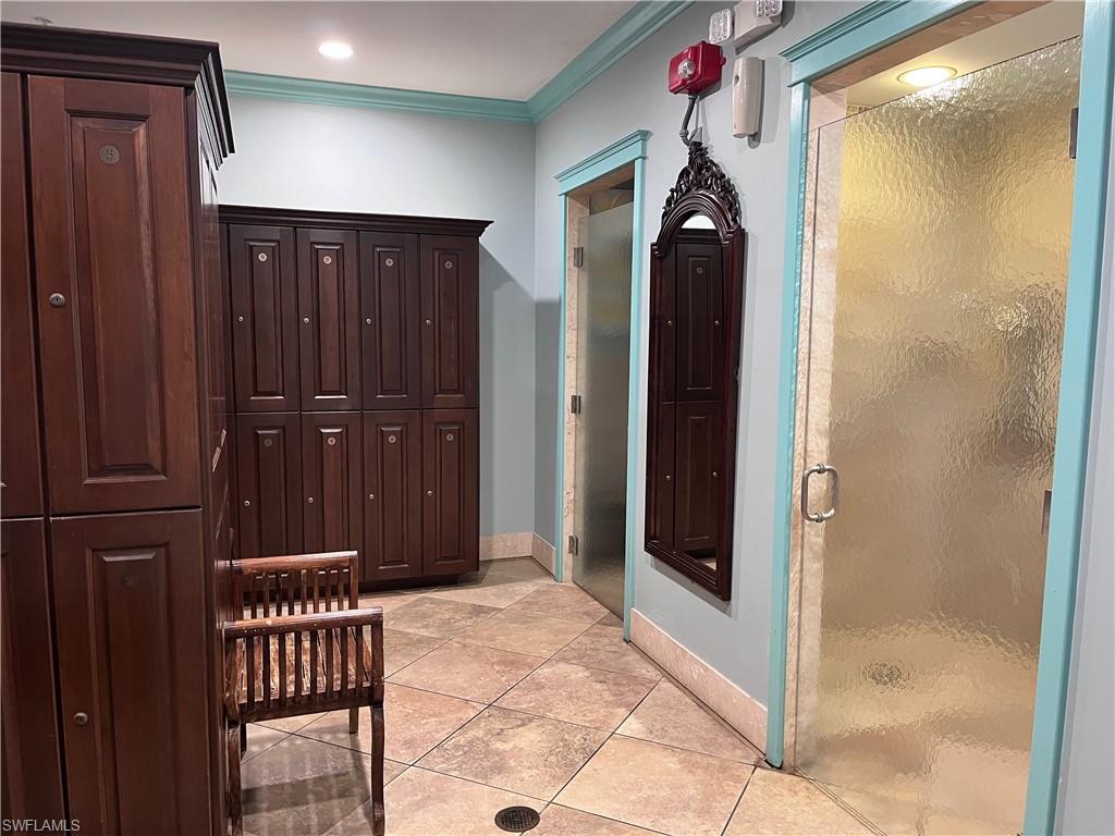 9126 Chula Vista Street, Unit 12301 Naples, FL 34113 - Photo 33 of 36 a view of a hallway with wooden doors