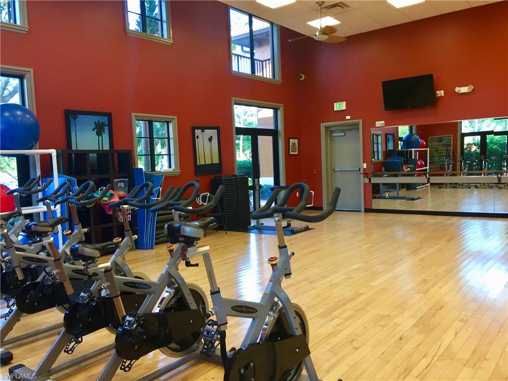 9126 Chula Vista Street, Unit 12301 Naples, FL 34113 - Photo 36 of 36 a view of a room with gym equipment