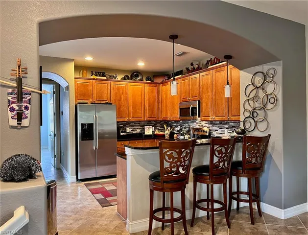 a dinning area with a table and chairs