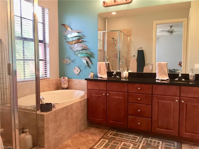 a bathroom with a sink double vanity and a mirror