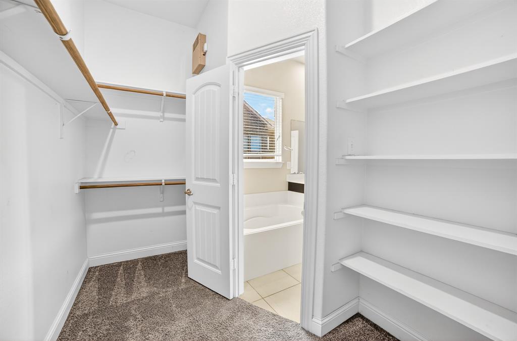 552 Winnetka Drive Oak Point, TX 75068 - Photo 31 of 40 a view of an empty walk in closet