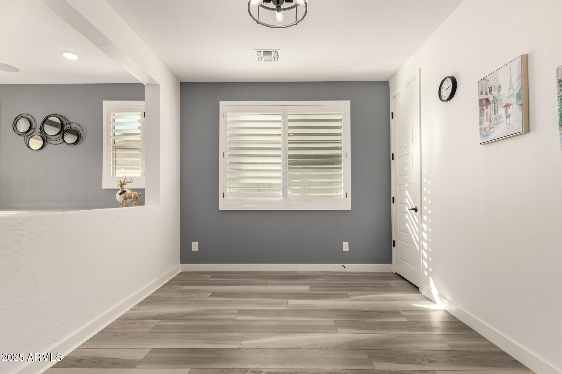 1501 East Rakestraw Lane Gilbert, AZ 85298 - Photo 10 of 71 a view of empty room with window and ceiling fan