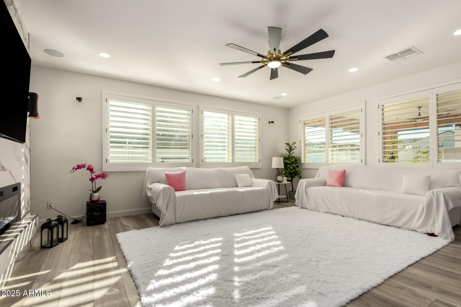 1501 East Rakestraw Lane Gilbert, AZ 85298 - Photo 13 of 71 a living room with furniture and a large window