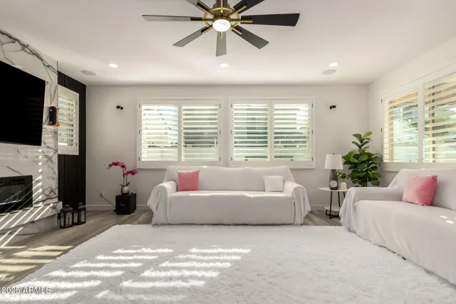 a kitchen with stainless steel appliances kitchen island granite countertop a sink and a refrigerator