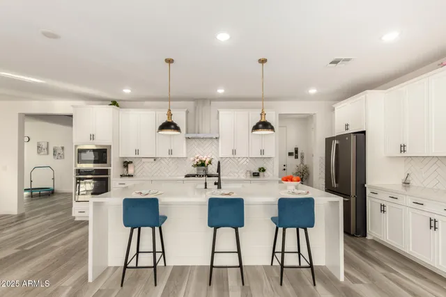 a bedroom with a bed and a dresser in it