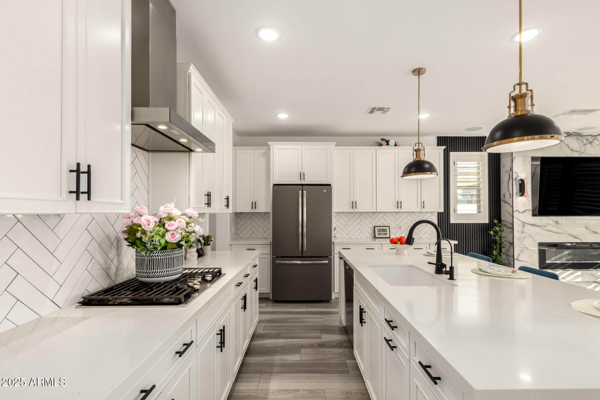 1501 East Rakestraw Lane Gilbert, AZ 85298 - Photo 18 of 71 a kitchen with stainless steel appliances kitchen island granite countertop a sink and a refrigerator