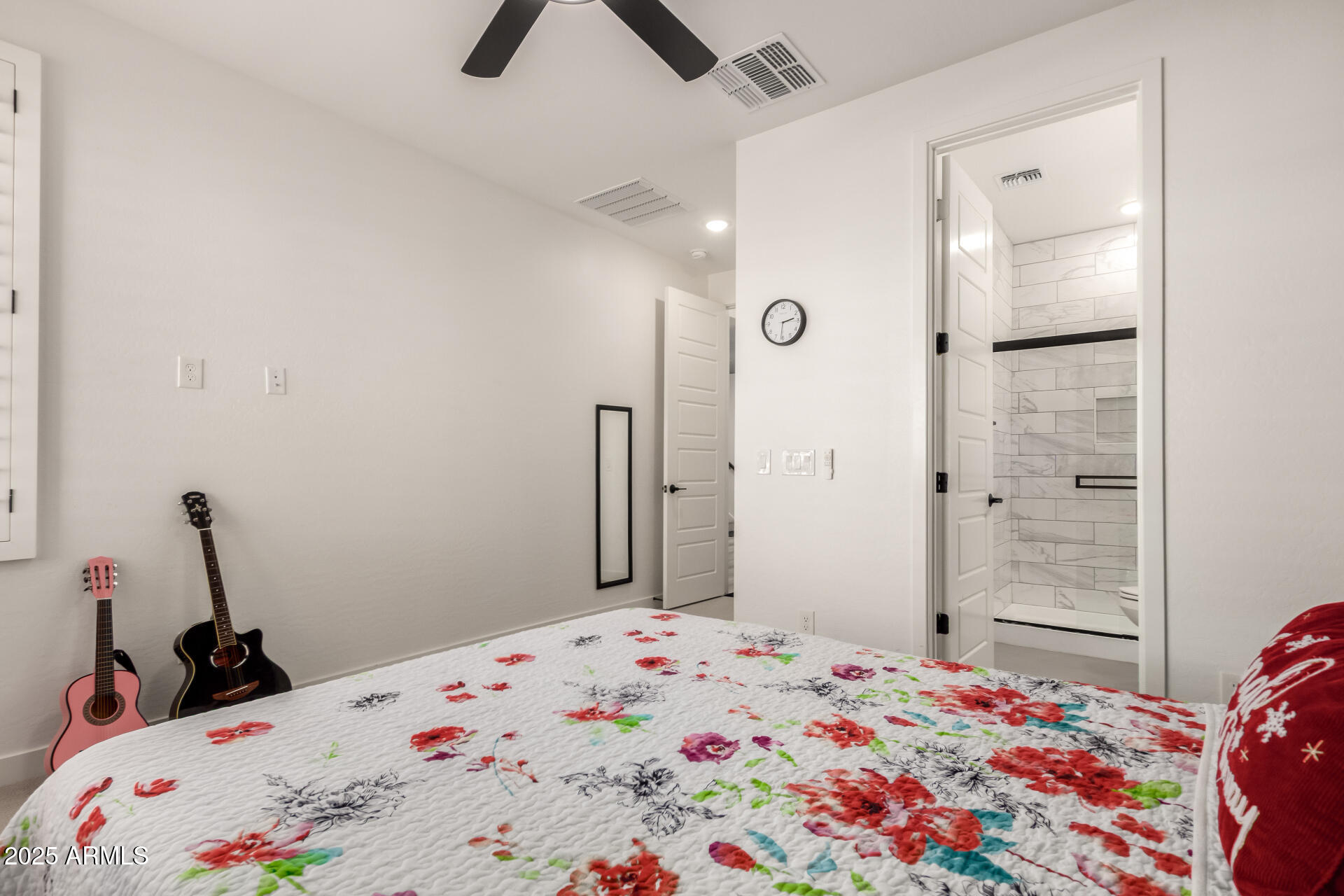1501 East Rakestraw Lane Gilbert, AZ 85298 - Photo 22 of 71 a bedroom with a bed and a dresser in it