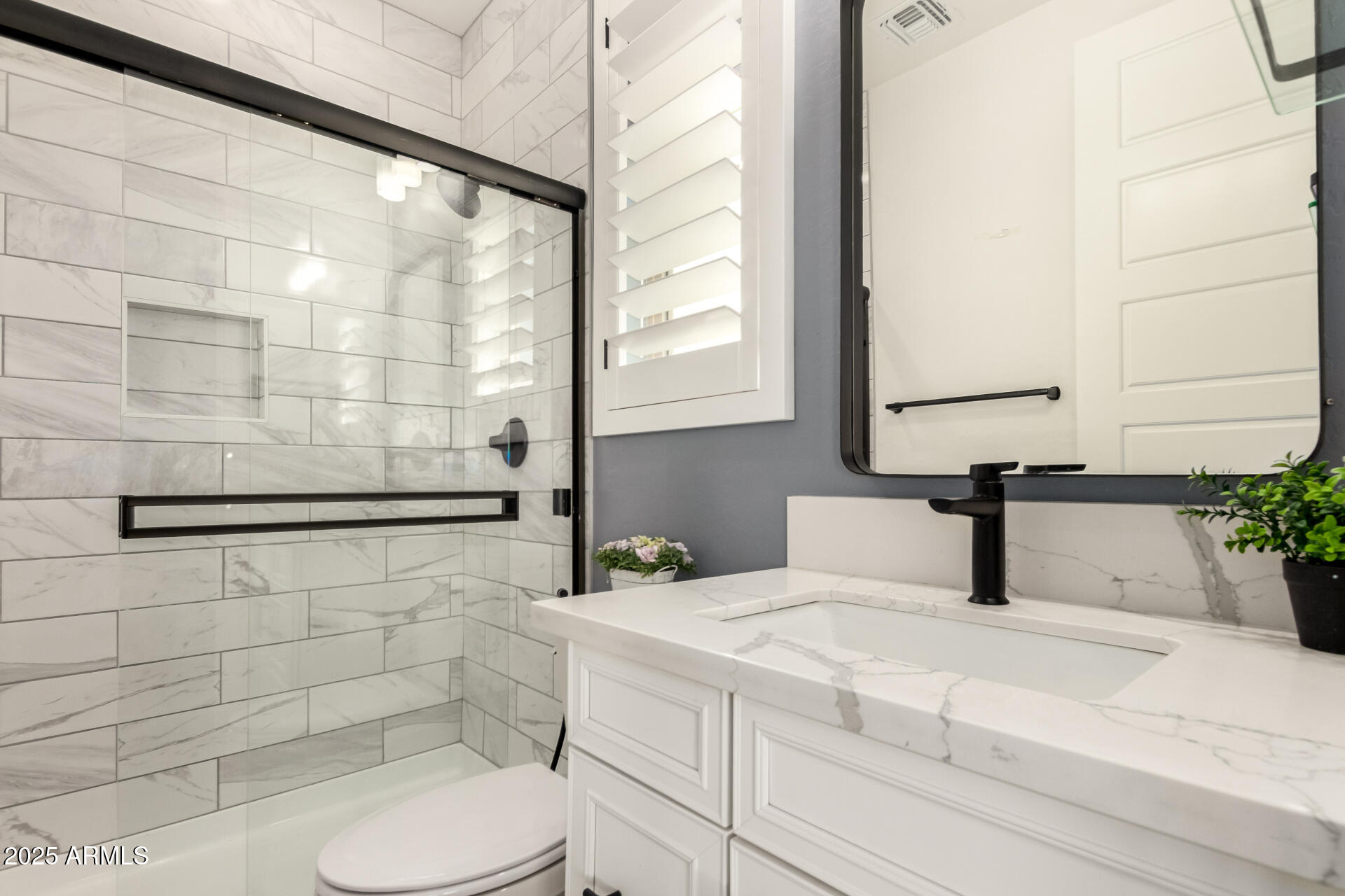 1501 East Rakestraw Lane Gilbert, AZ 85298 - Photo 23 of 71 a bathroom with a sink and a mirror