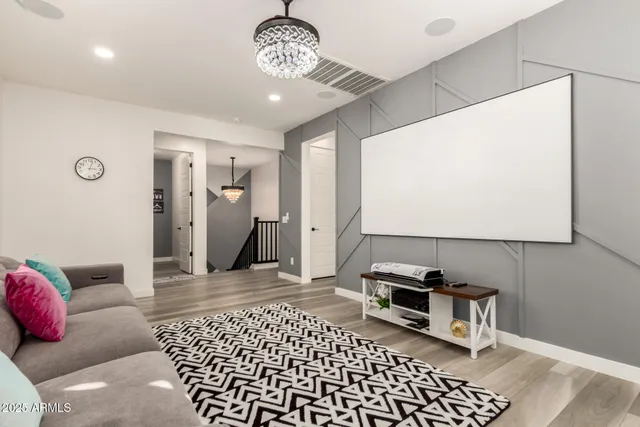 a bathroom with a tub shower sink and mirror
