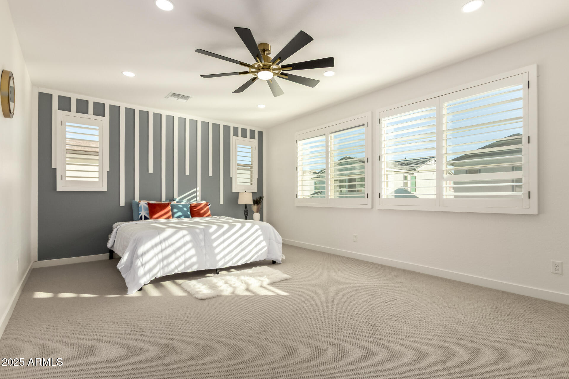 1501 East Rakestraw Lane Gilbert, AZ 85298 - Photo 28 of 71 a bed sitting in a bedroom next to a window