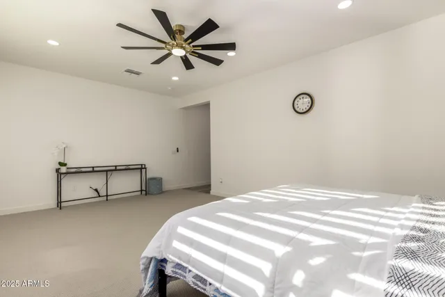 a living room with furniture a window and gym equipment