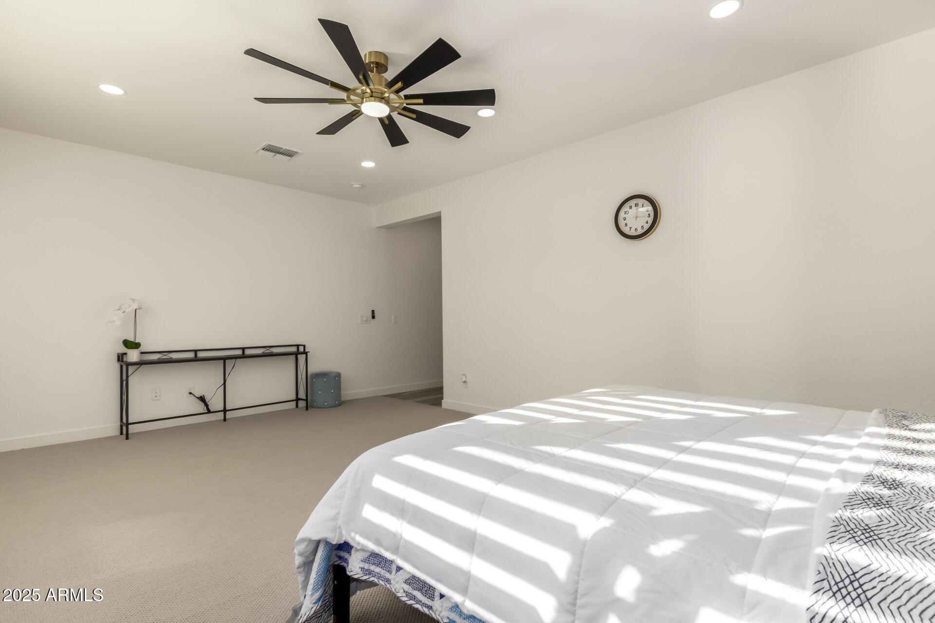 1501 East Rakestraw Lane Gilbert, AZ 85298 - Photo 30 of 71 a bedroom with a bed and a ceiling fan