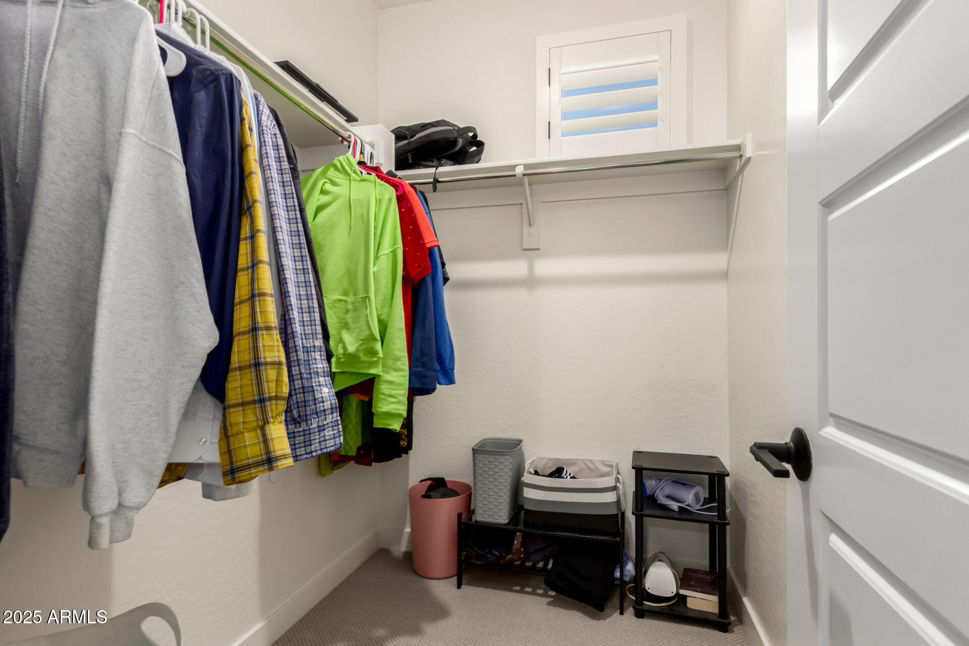 1501 East Rakestraw Lane Gilbert, AZ 85298 - Photo 39 of 71 a view of walk in closet with clothes and shoes