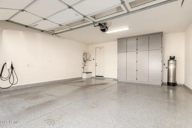 a view of a house with backyard sitting area and furniture
