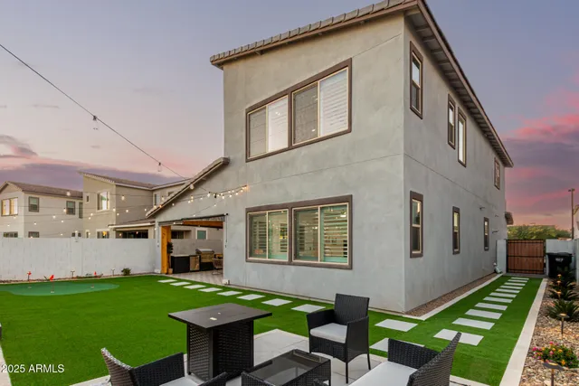 a view of swimming pool with outdoor seating and lake view